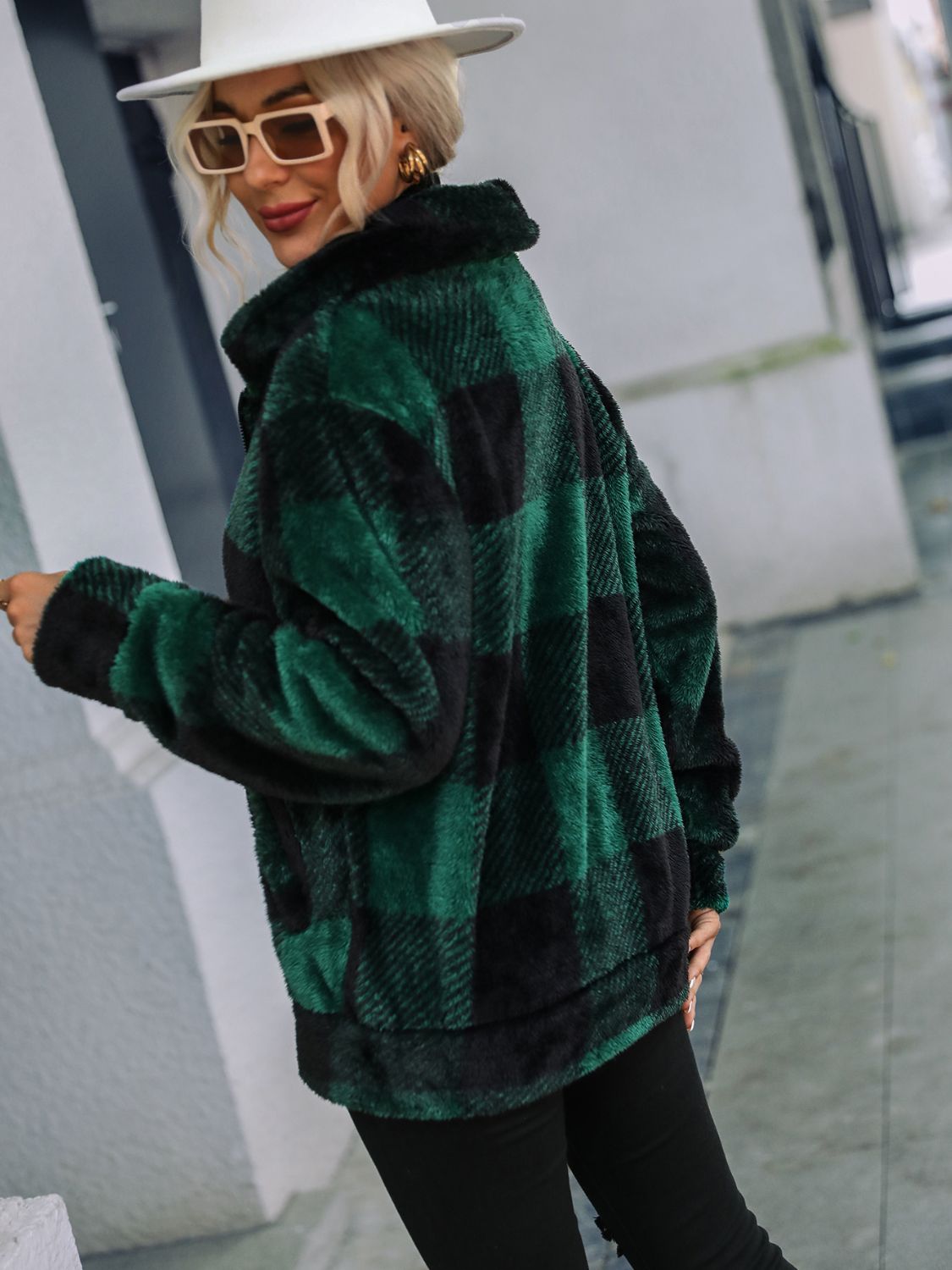 Green and black plaid sherpa zip-up jacket with a collared neckline.