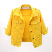 Citrus denim trucker jacket in gold with cropped sleeves and button front.
