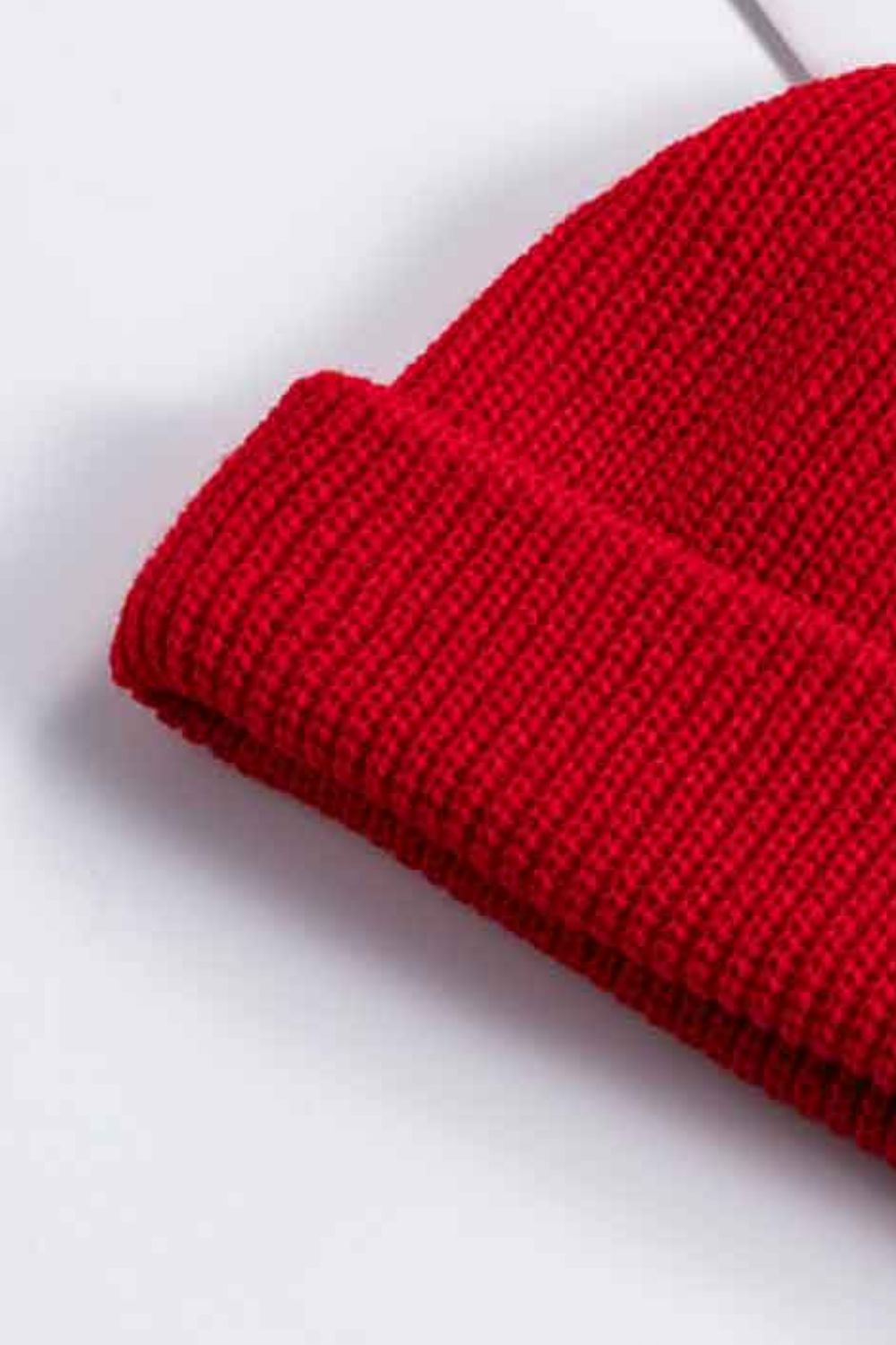 Red ribbed knit beanie with a turned-up brim