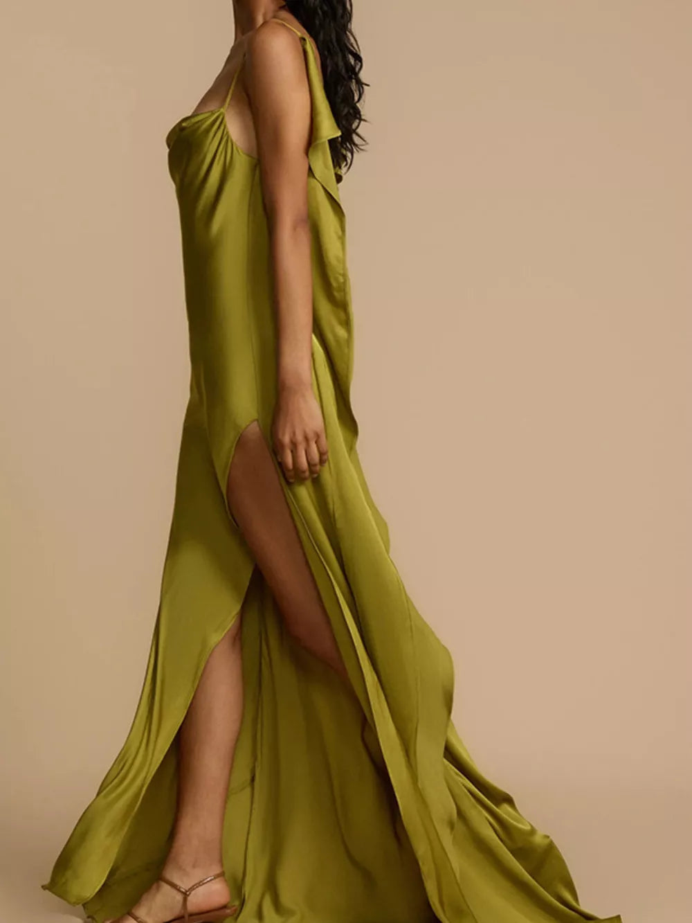 Lustrous satin maxi dress with cowl neck, spaghetti straps, and a high slit.