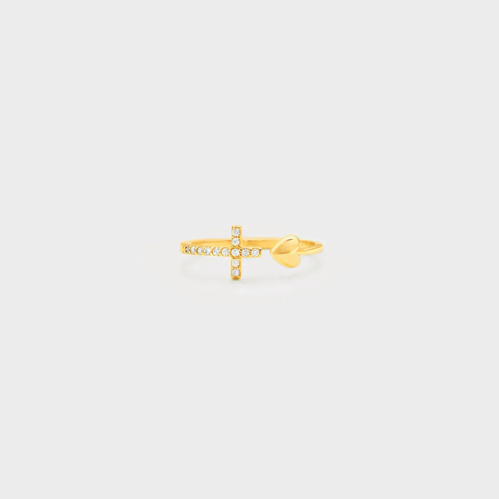 Gold ring with open heart and diamond-accented cross detail