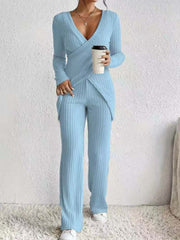 Pastel blue ribbed knit crossover lounge set with long sleeves and wide leg pants.