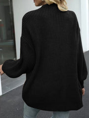 Black chunky knit cocoon cardigan with balloon sleeves and a relaxed fit.