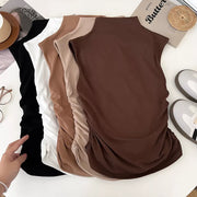 Textured ruching mock neck tank top in brown, black, white, and apricot with draped detail.