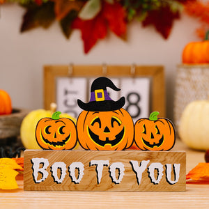 Halloween pumpkin display with Boo To You text on wood block