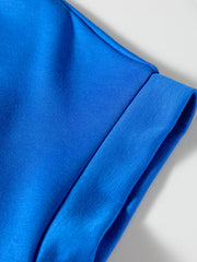 Vibrant blue polo shirt detail showing collar and cuff seam.