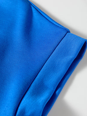 Vibrant blue polo shirt detail showing collar and cuff seam.