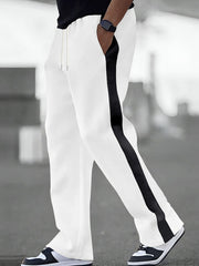 White sweatpants for men with a black contrast stripe down the side and drawstring waist.