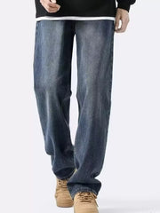 Men's classic vintage loose-fit blue denim jeans with a relaxed cut.