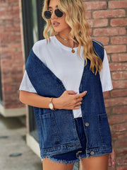 Oversized denim vest in medium blue with patch pockets and button front.