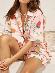 Pink co-ord pajama set with limoncello print, button-up shirt and shorts.