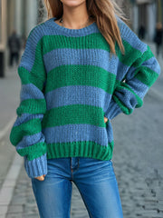 Chunky knit jumper with bold blue and green stripes, crew neck, and long sleeves.