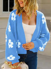 Blue acrylic floral puff sleeve open cardigan with white blooms.