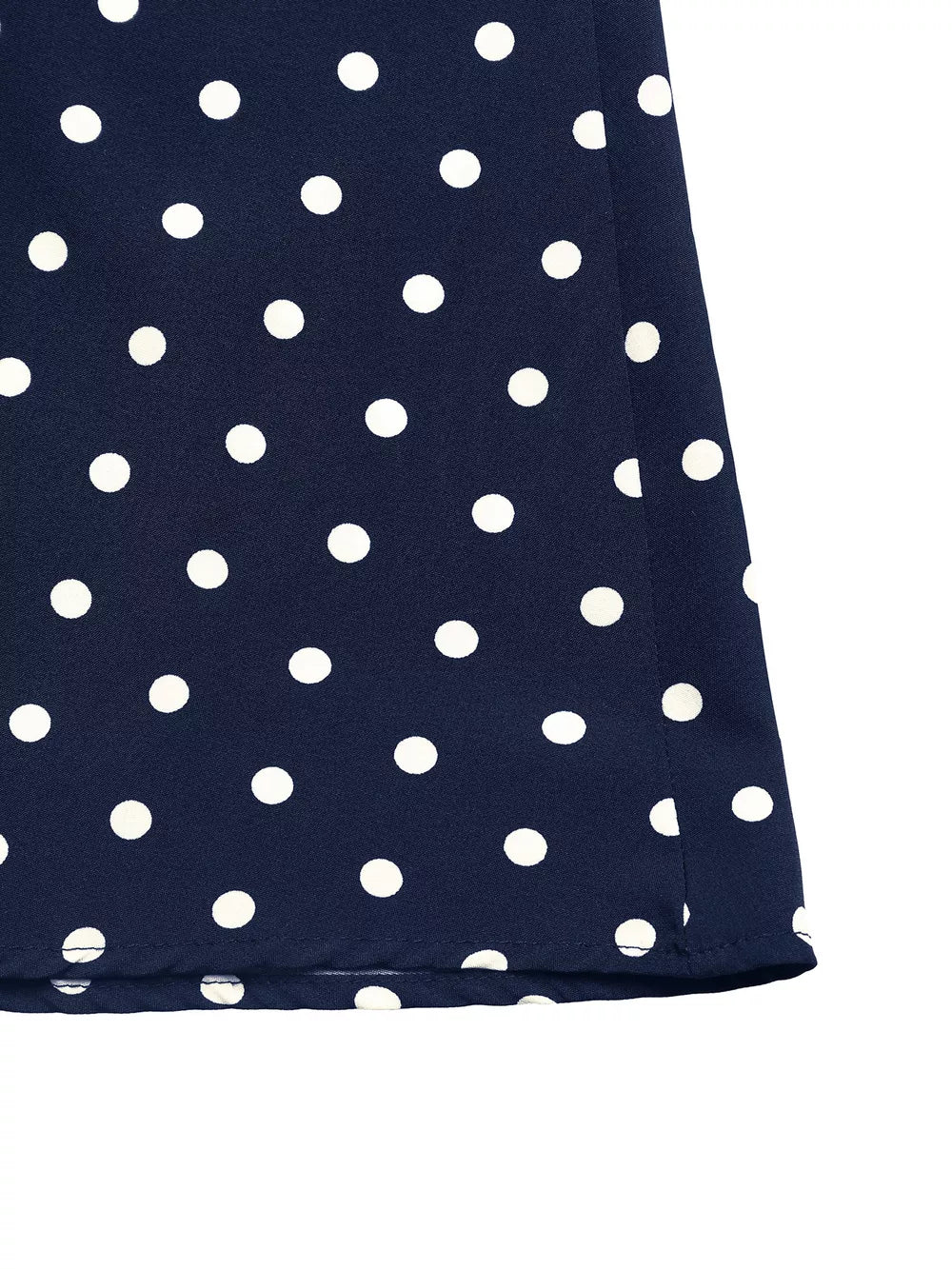 Navy polka dot A-line maxi dress hem detail