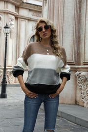 Crewneck knit sweater with horizontal color blocks in brown, white, gray, and black acrylic.