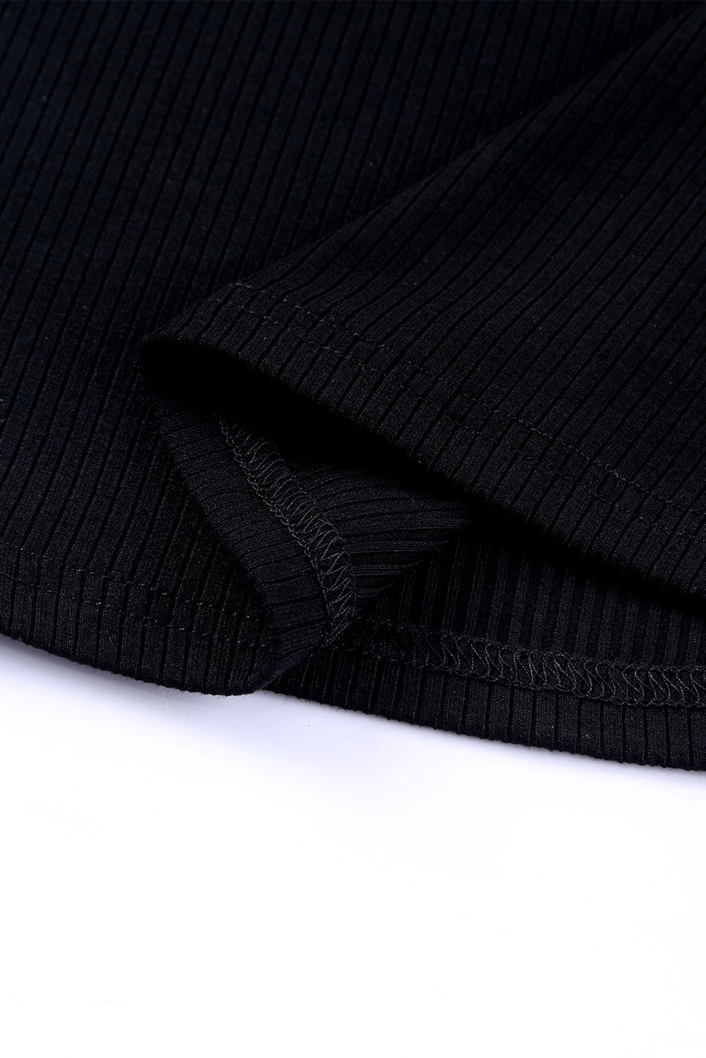 Black ribbed knit blouse with dot mesh sleeves detail