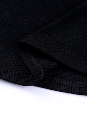 Black ribbed knit blouse with dot mesh sleeves detail