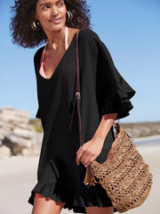 Black ruffled V-neck beach cover-up with flutter sleeves and hem detail.