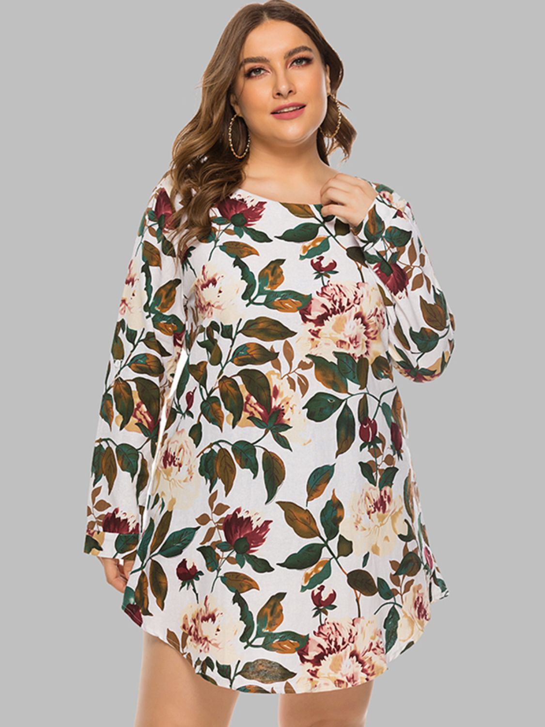 Botanical print trapeze mini dress with long sleeves and a round neckline in ivory.