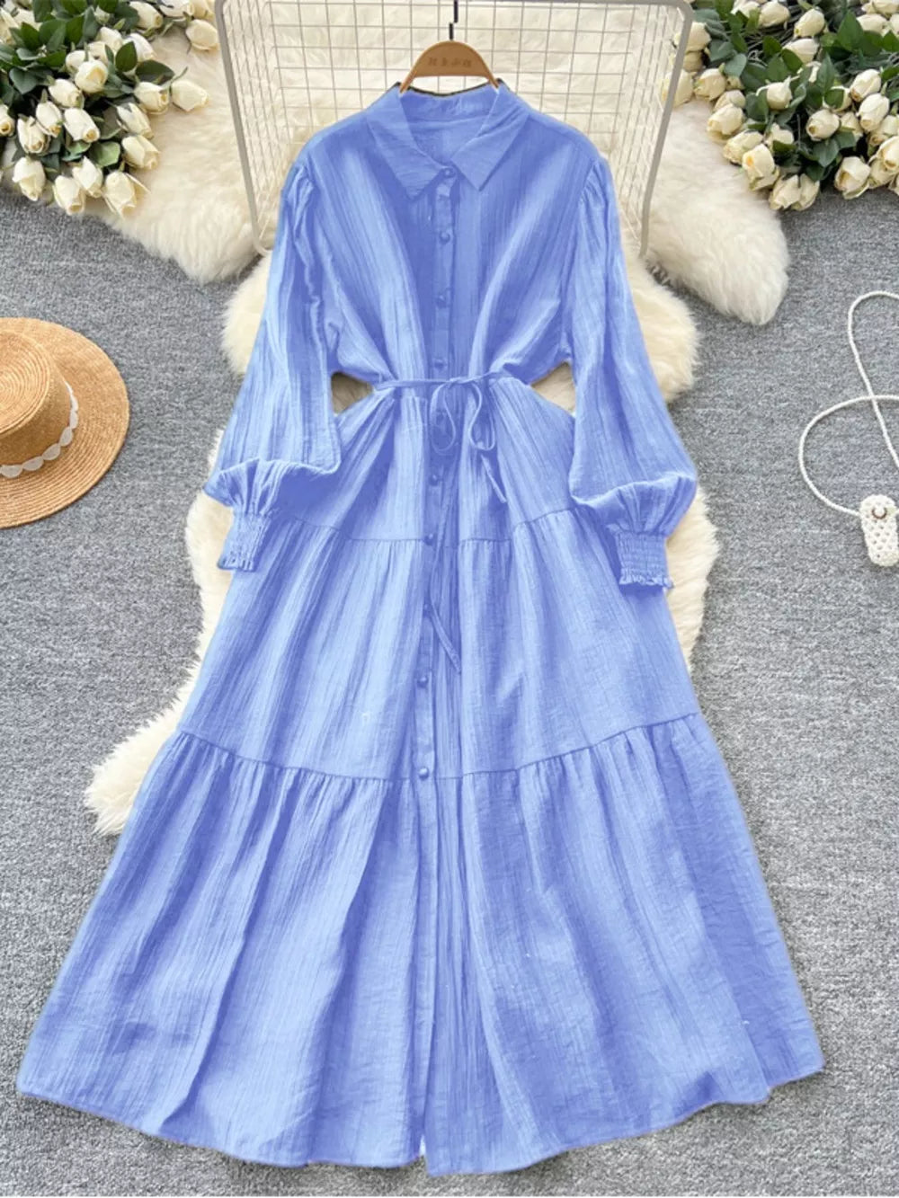 Blue textured tiered long sleeve button-down midi dress with tie waist