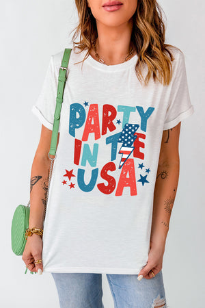 White graphic tee with distressed red, white, and blue USA text print and lightning bolt detail.