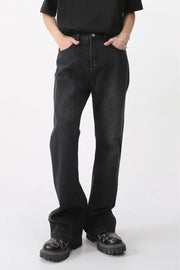 Dark denim wide-leg trousers with vertical seams and a comfortable fit.