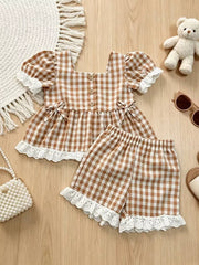 Brown gingham baby set with ruffle trim and lace details.