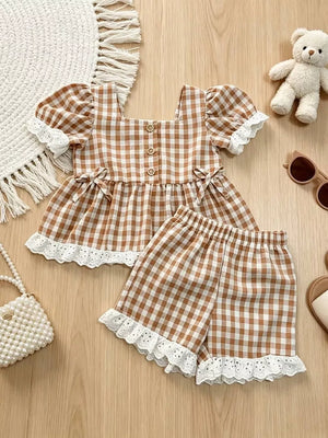 Brown gingham baby set with ruffle trim and lace details.