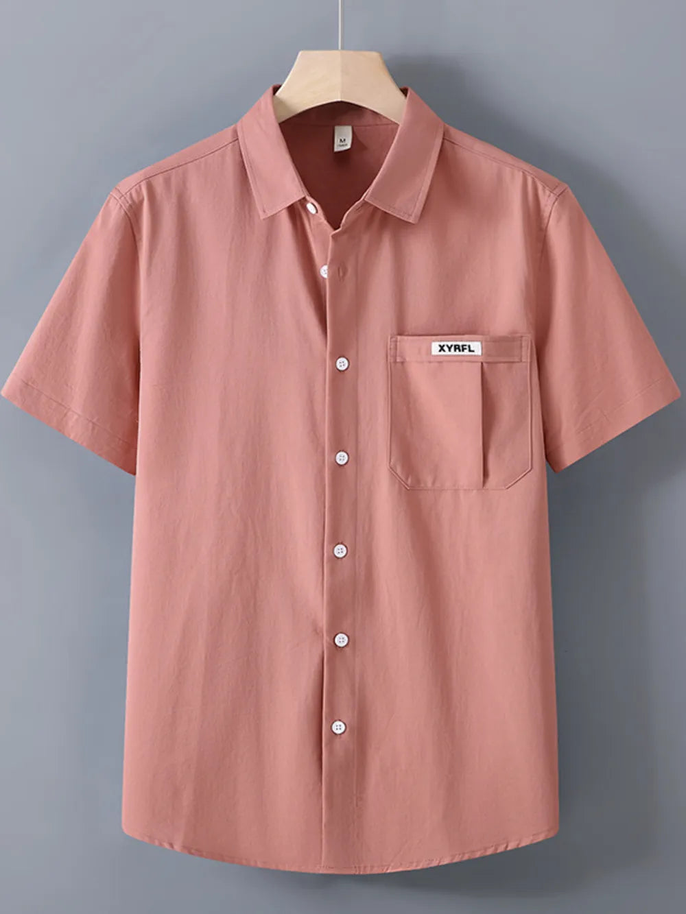 Coral short-sleeve button-up shirt with chest pocket and white buttons.