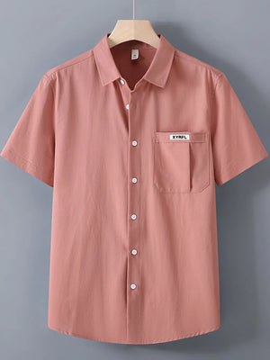Coral short-sleeve button-up shirt with chest pocket and white buttons.