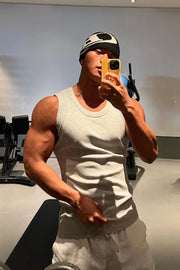 Gray ribbed cotton muscle tank top with a crew neck.
