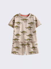 Toddler cotton two-piece set with allover dinosaur print and orange trim.