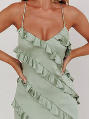 Sage spaghetti strap maxi dress with diagonal ruffles and a V-neckline.