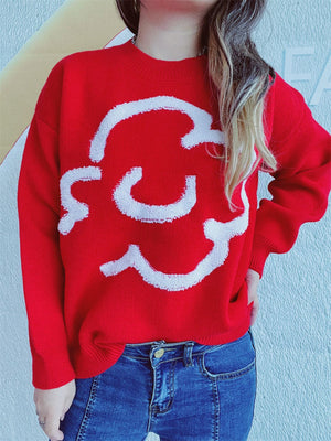 Red acrylic sweater with white cloud intarsia, crew neck, long sleeves.