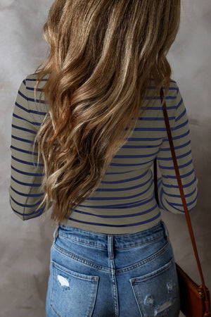 Ribbed stripe long sleeve henley top in tan with navy stripes.