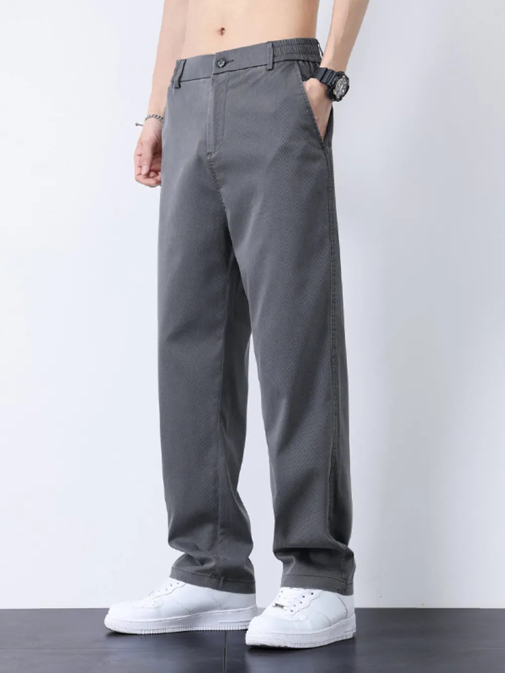 Relaxed fit gray casual pants with a subtle textured pattern and elastic waistband.