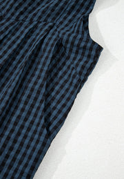 Dark blue gingham textured wide-leg overalls with button detail