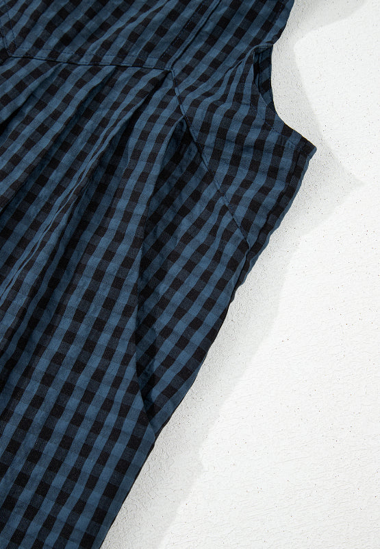 Dark blue gingham textured wide-leg overalls with button detail