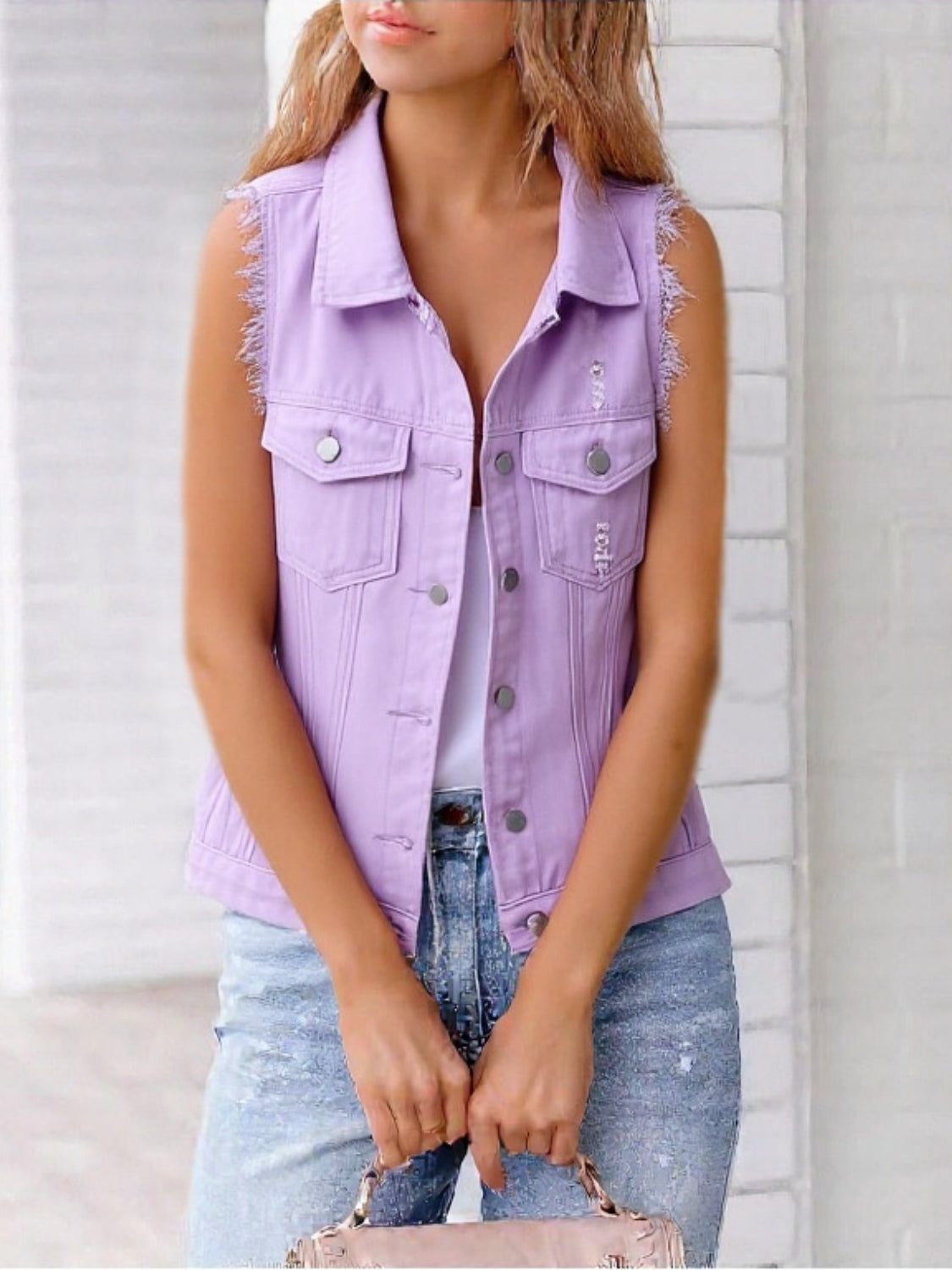 Lavender denim vest with frayed shoulders and distressed details