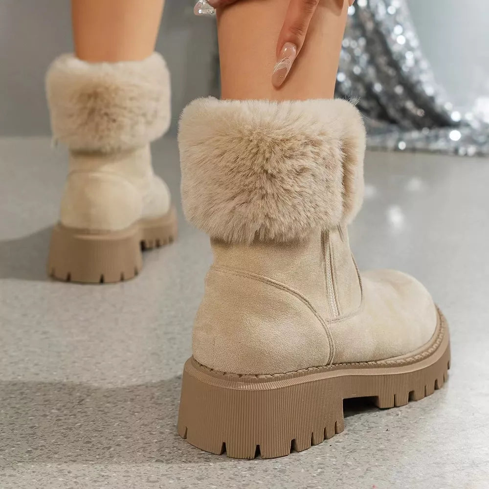 Creamy-white suede ankle boots with faux fur trim and chunky sole.