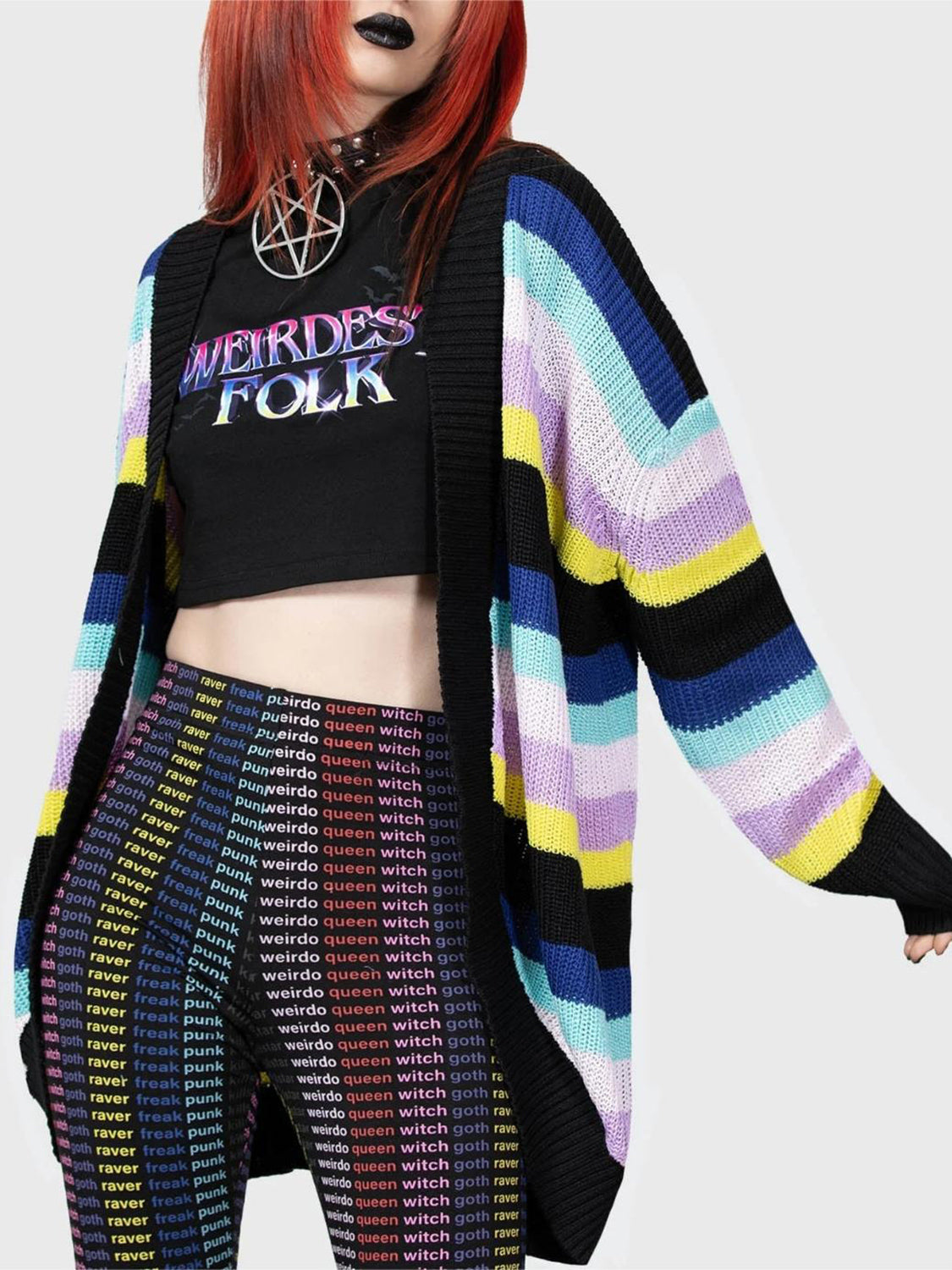 Oversized knit cardigan with rainbow stripes in multicolor, black trim, and long sleeves.