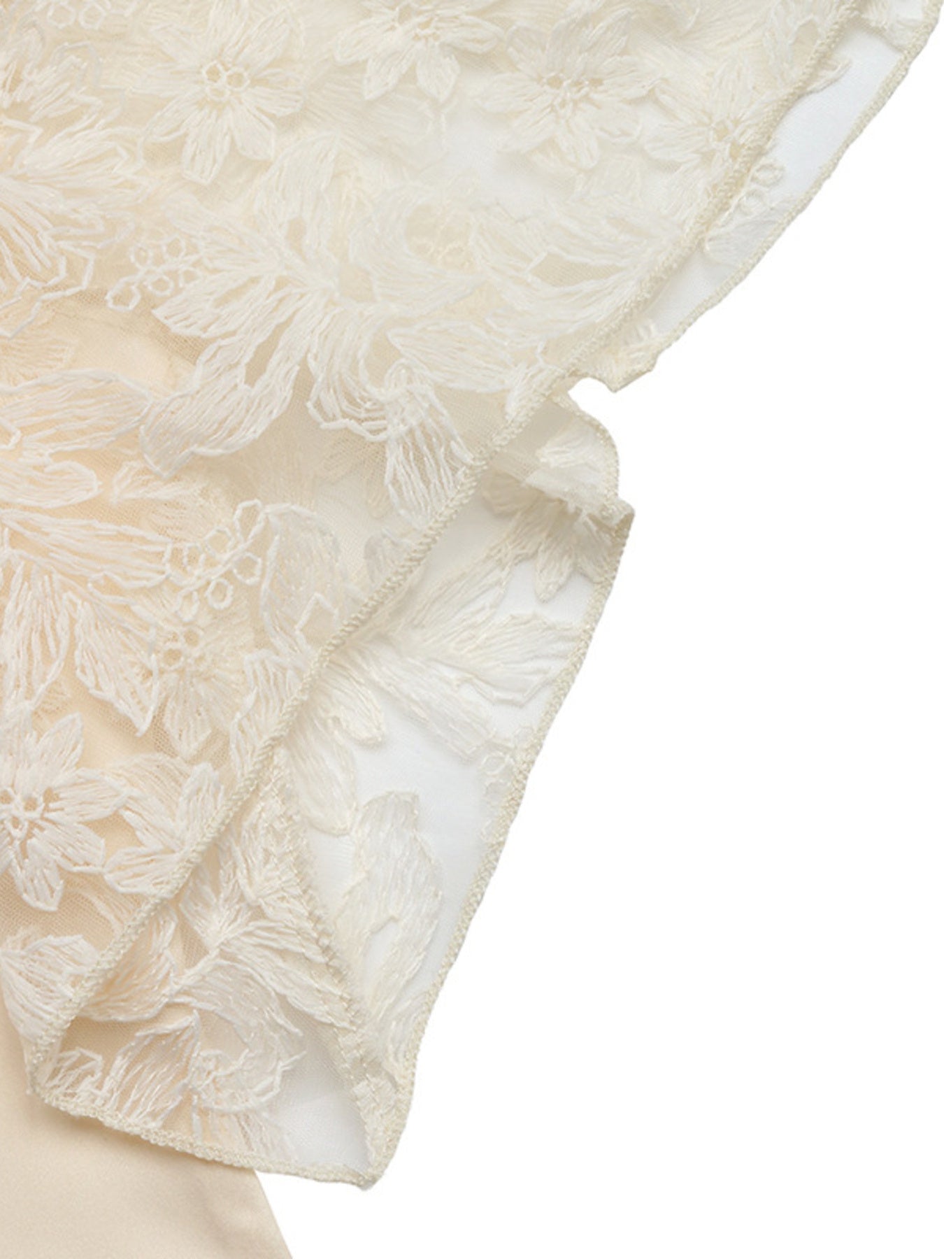 Apricot lace trimmed short sleeve blouse with floral embroidery detail.