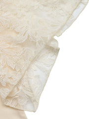Apricot lace trimmed short sleeve blouse with floral embroidery detail.