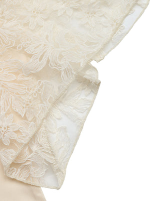 Apricot lace trimmed short sleeve blouse with floral embroidery detail.