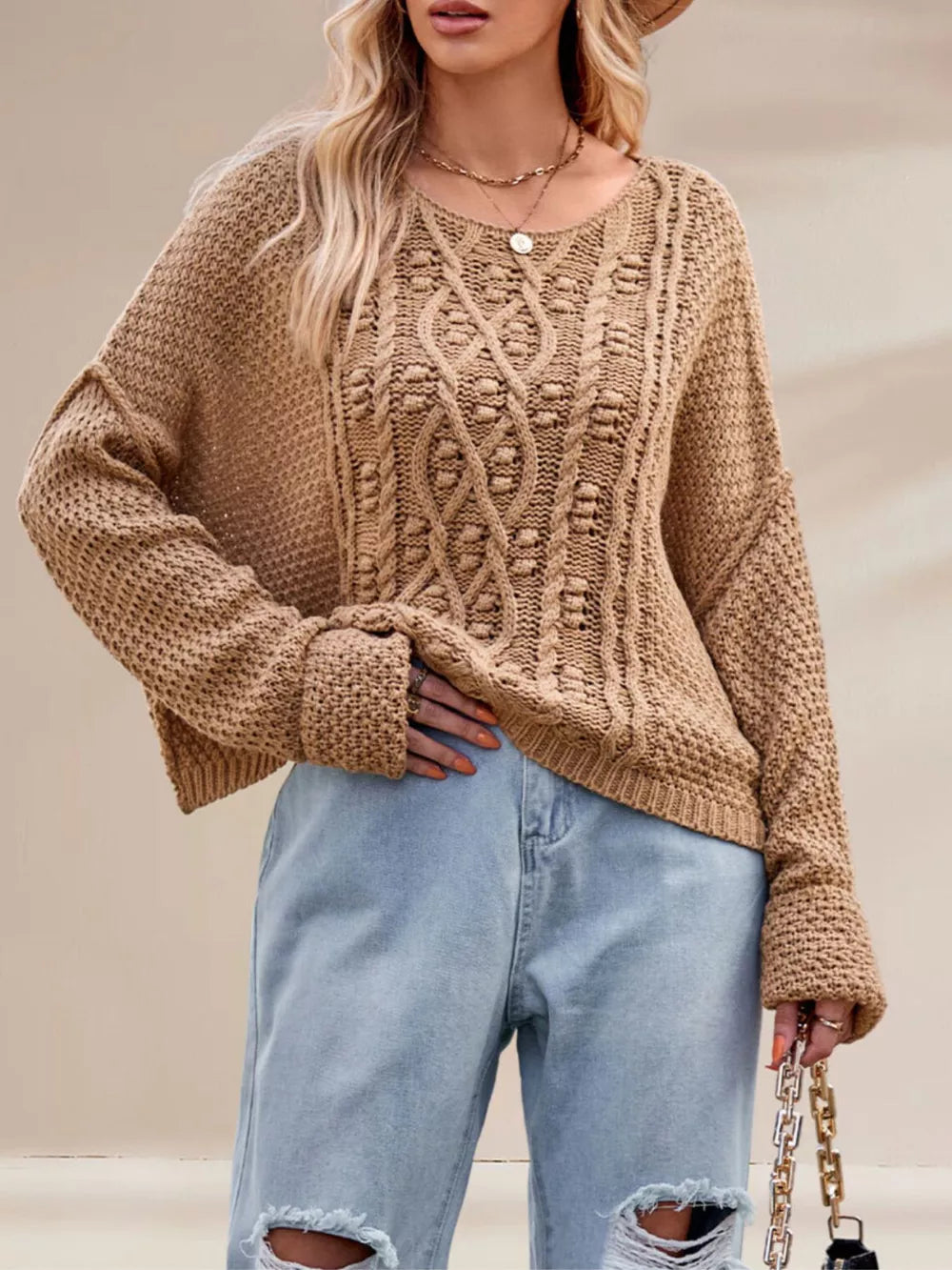 Apricot pullover sweater featuring cable-knit and cable knit