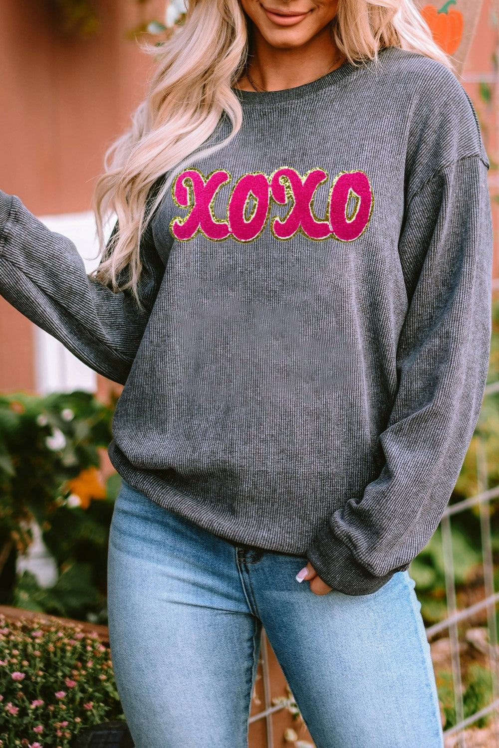 Dark Gray ribbed sweatshirt with pink XOXO appliqué and gold trim.