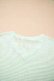 Light green waffle knit maternity t-shirt with V-neck detail