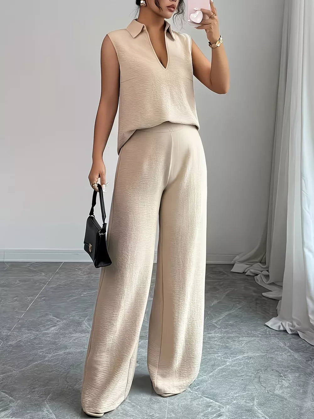 Beige sleeveless collared V-neck top and textured wide-leg pants set.