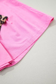 Pink chino shorts with leopard print belt detail