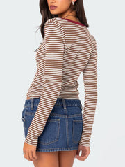 Striped long sleeve Henley shirt with contrast collar and button detail.